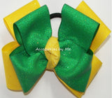 Glitter Emerald Green Yellow Cheer Bow with a Match Yellow Center Glitter Knot.